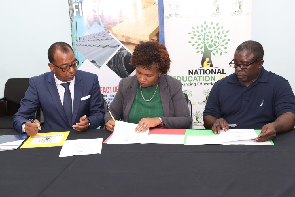 Norman Horne (left), Executive Chairman of ARC Manufacturing Limited, signs the Letter of Intent alongside Latoya Harris-Ghartey (centre), Executive Director of the National Education Trust (NET), and Colin Cameron (right), Principal of Bull Savannah Primary and Infant School. This agreement marks the beginning of a collaborative effort to restore the Bull Savannah Primary and Infant School, which was severely damaged during the passage of Hurricane Beryl, for the reopening of the new school year on August 26, 2024.